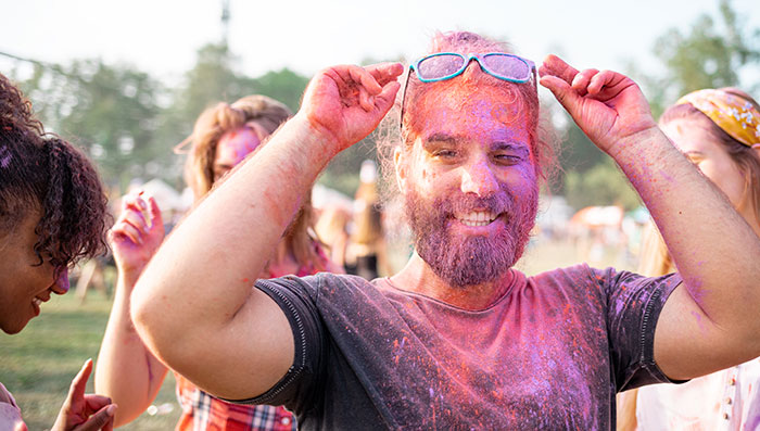 Colorful friends at summer holi festival