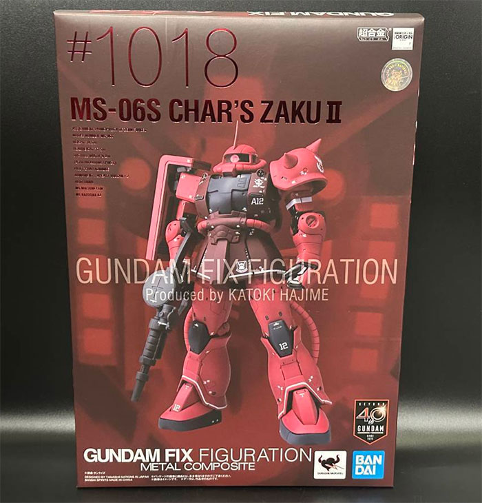 Red Gundam toy robot in the box