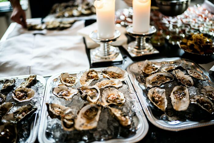 Plates filled with Oysters on the table 