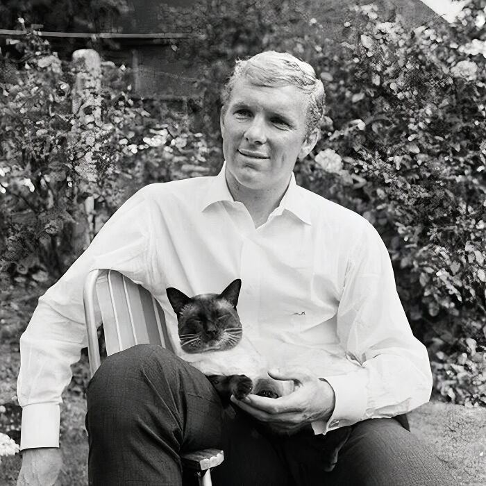 In An Intimate Moment With His Pet Cat, British Football Player Bobby Moore, Then Captain Of West Ham United, Was Captured By His Fellow Countryman Photographer Eric Marlow In 1965