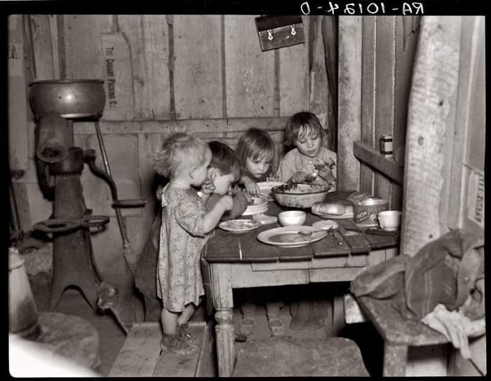 December 1936: "Christmas Dinner In Home Of Earl Pauley Near Smithfield, Iowa. Dinner Consisted Of Potatoes, Cabbage And Pie." Photograph By Russell Lee For The Farm Security Administration
