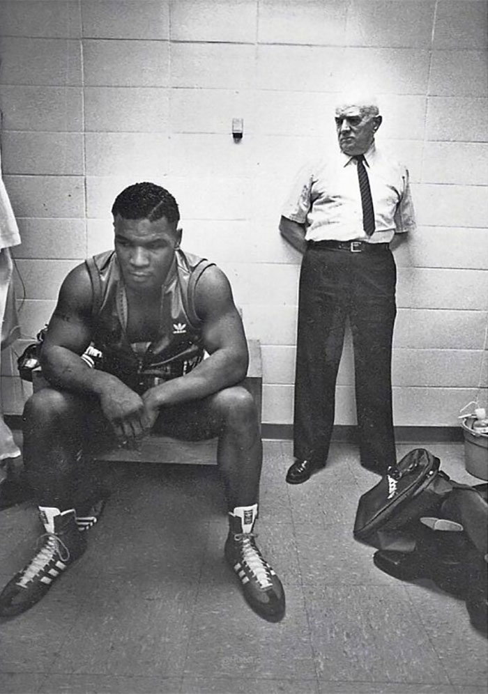 1985. 18-Year-Old Mike Tyson And His Trainer, Cus D'amato, Before His First Professional Fight Against Hector Mercedes. The Fight Lasted 1 Minute And 47 Seconds, With Tyson Defeating Hector Mercedes Via First-Round Tko. Photo By Ken Regan