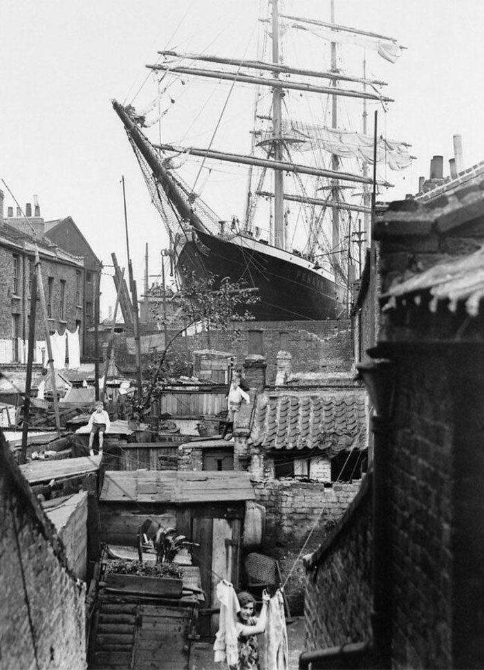 1932. Sailing Ship S.v. Penang In Millwall Docks, London, Towers Above The Poverty Of The Surrounding Housing