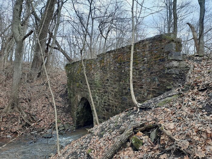 Abandonded Stone Bridge In The Woods