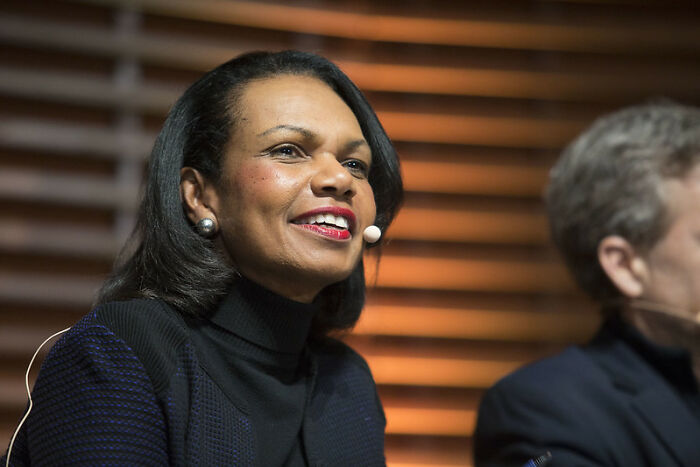 Condoleezza Rice smiling warmly, illustrating celebrities who never married yet still found love.