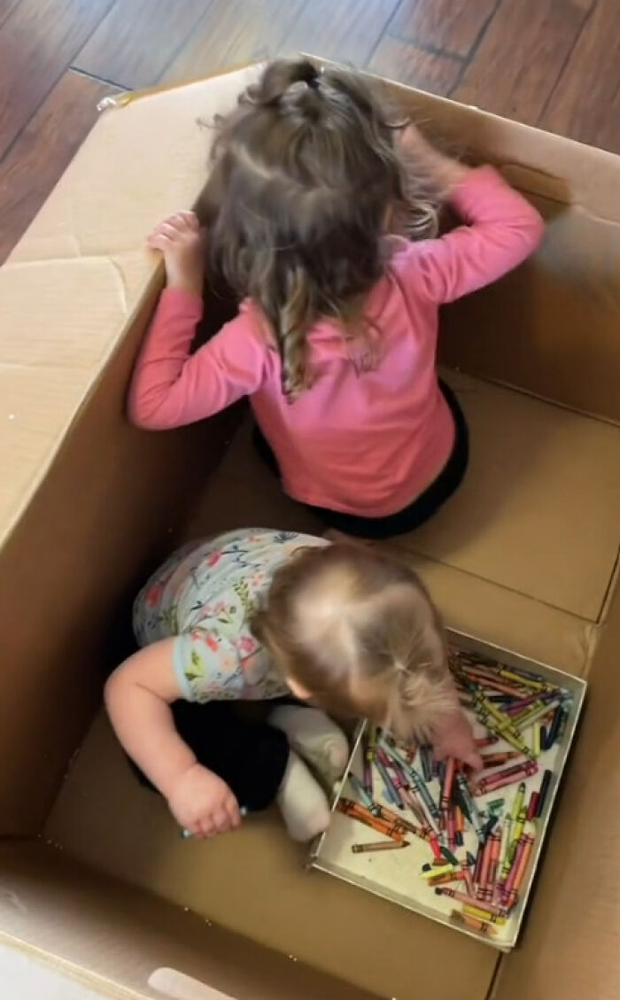 A mother sparks an argument after putting her kids in a box of crayons so they can do housework in peace