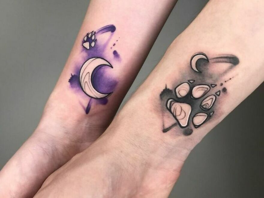 paw and moon watercolor tattoo on the forearms