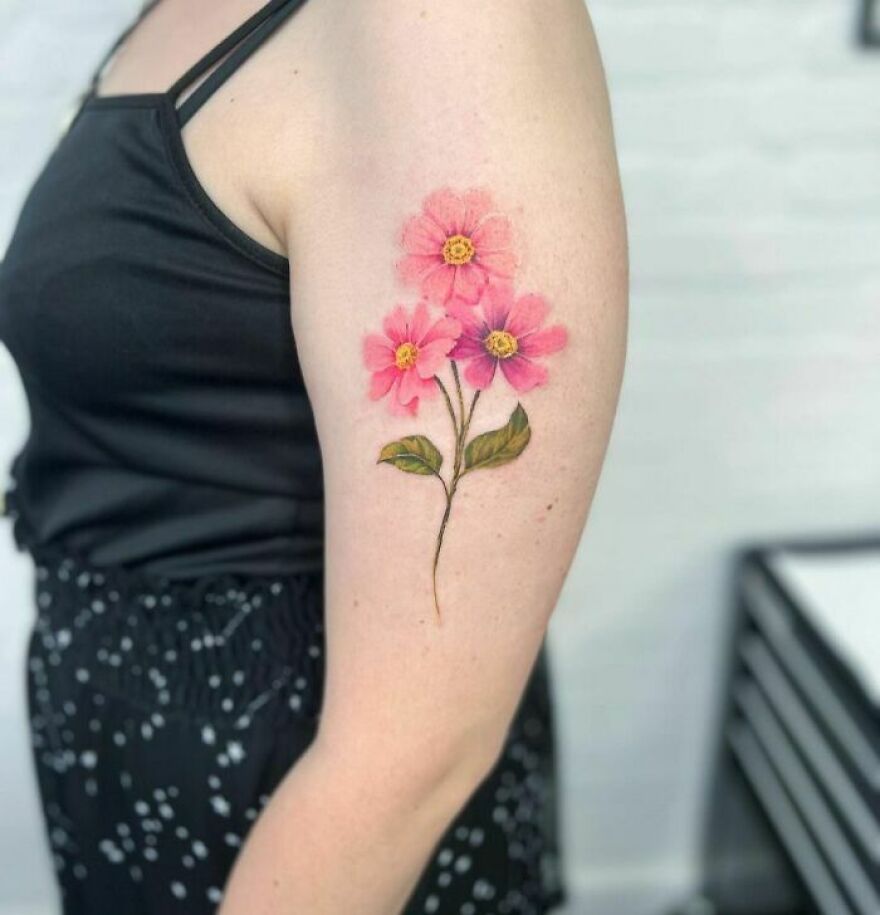 watercolor flowers tattoo on the arm