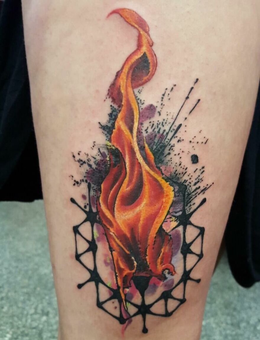 colorful flame tattoo on the arm