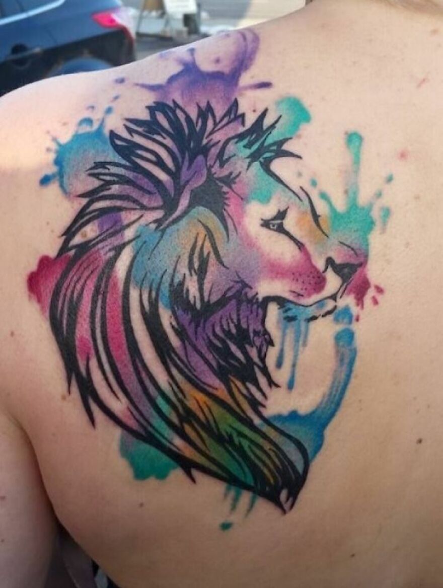 colorful lion tattoo on the back