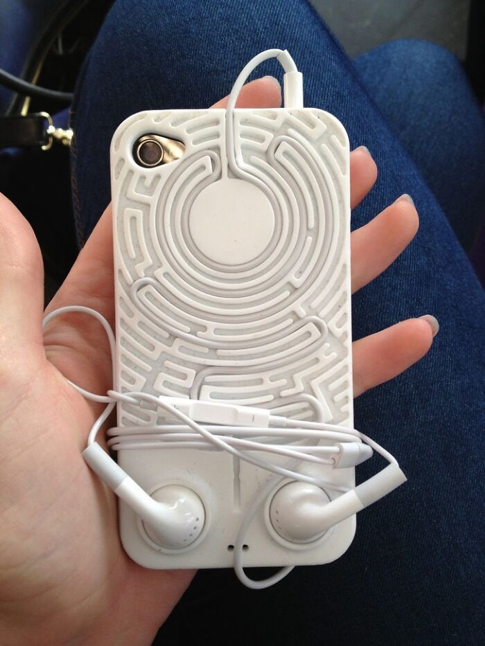 A Maze Of Concentric Circles On The Back Of The Phone Fitting Its Earphones Perfectly