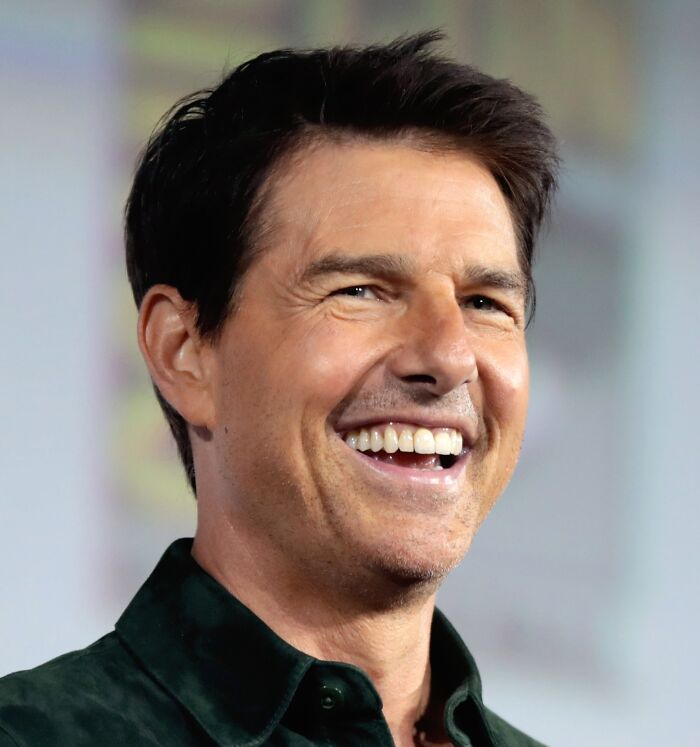 Tom Cruise smiling and laughing 
