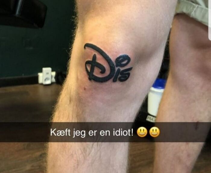 Funny Disney tattoo on a knee with playful lettering, showcasing humor in body art.
