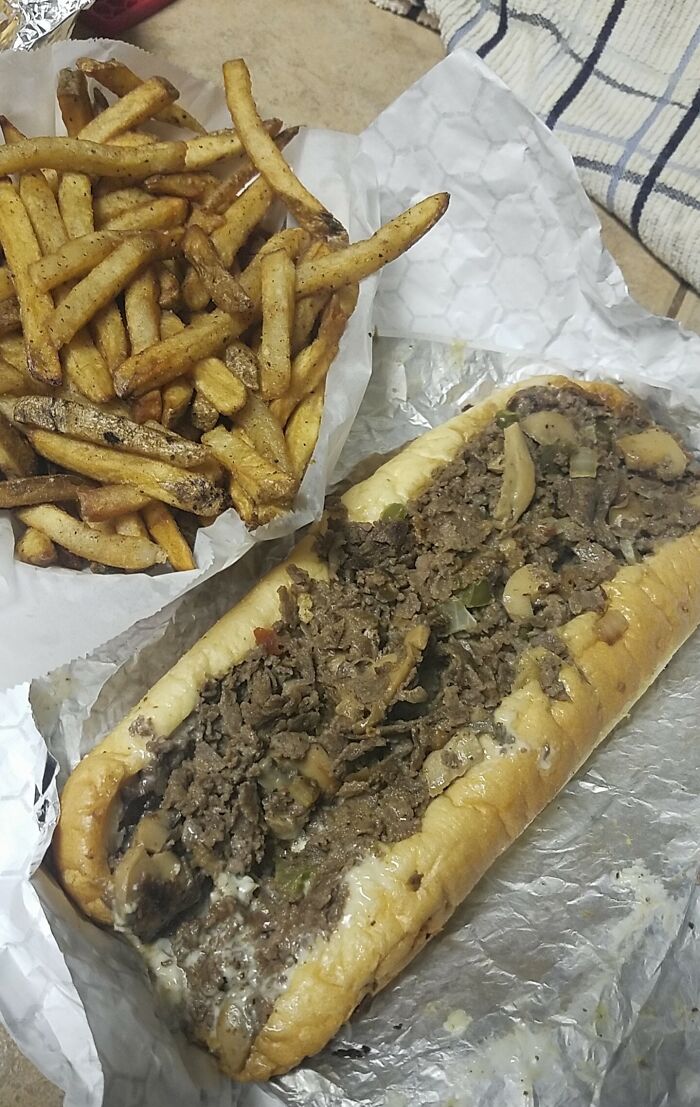A Very Large Cheesesteak And Fries. I Live In San Antonio, TX And It's From A Food Truck That Makes Its Way Around The City