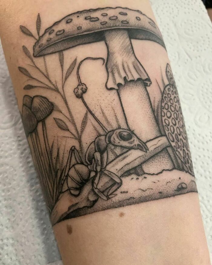 Mushroom and ant hand tattoo 