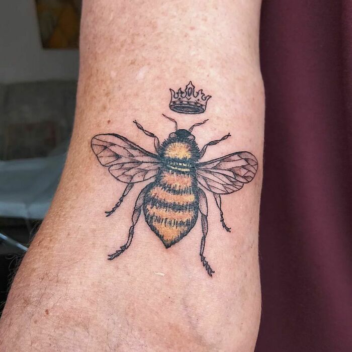 Bee with a crown tattoo