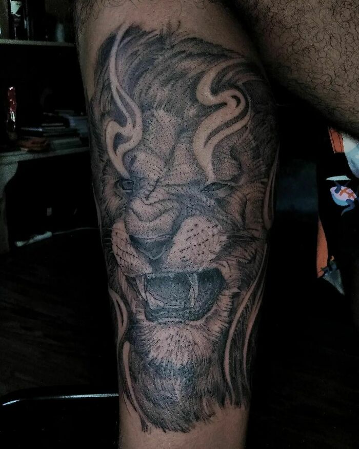 Angry lion tattoo