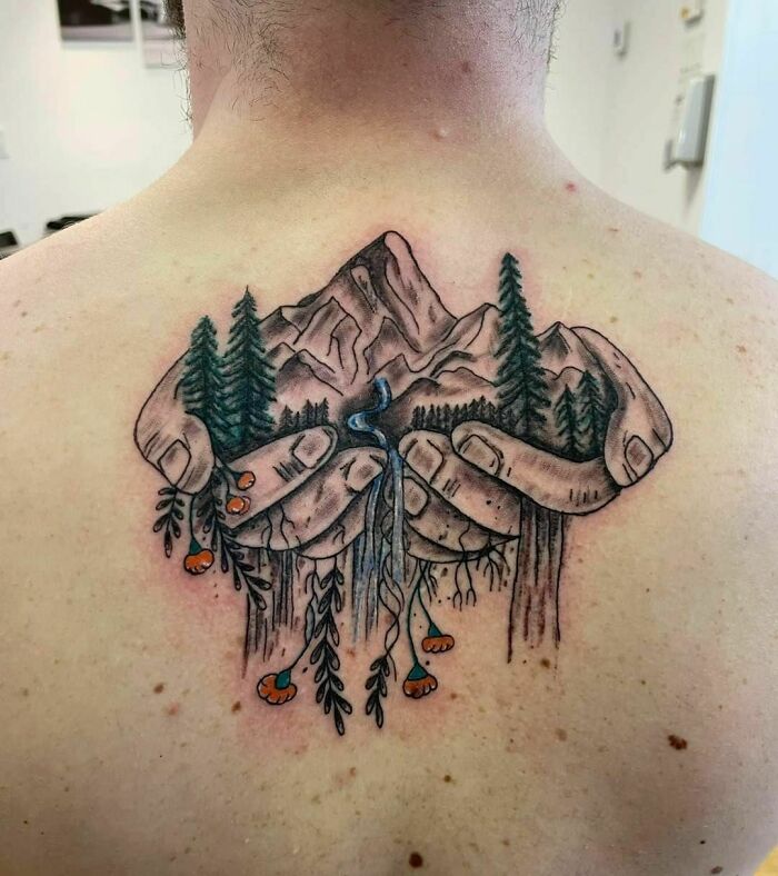 Hand and nature back tattoo 