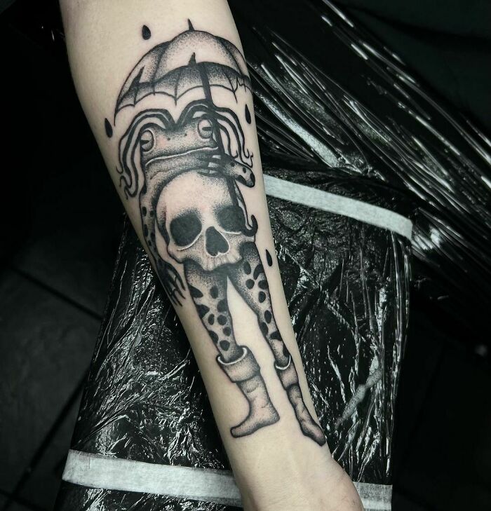 Death frog arm tattoo 