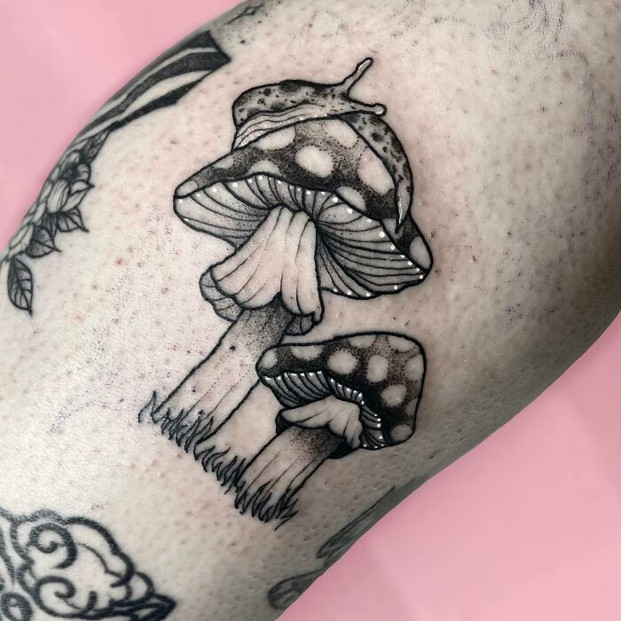 Slug and mushrooms leg tattoos 