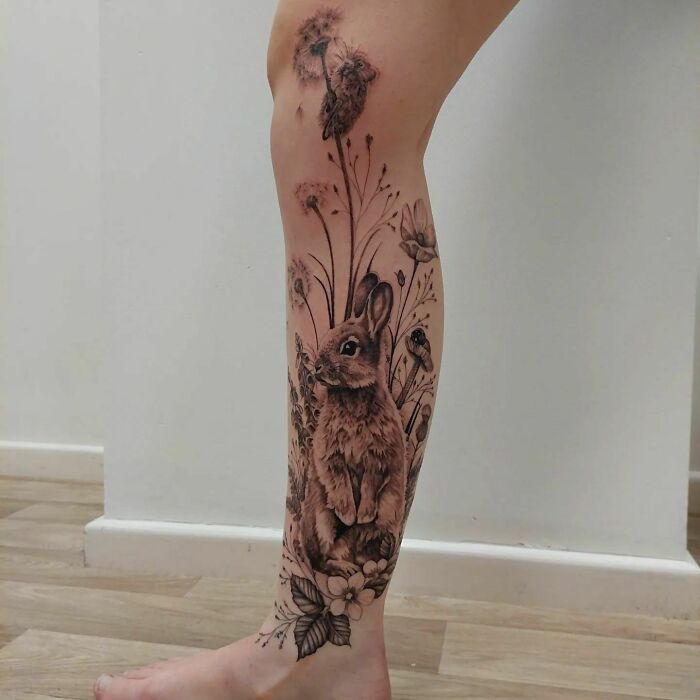 Rabbit and flower full leg tattoo 