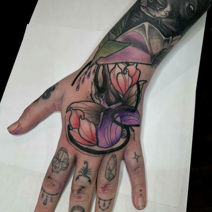 Colorful flower hand tattoo 