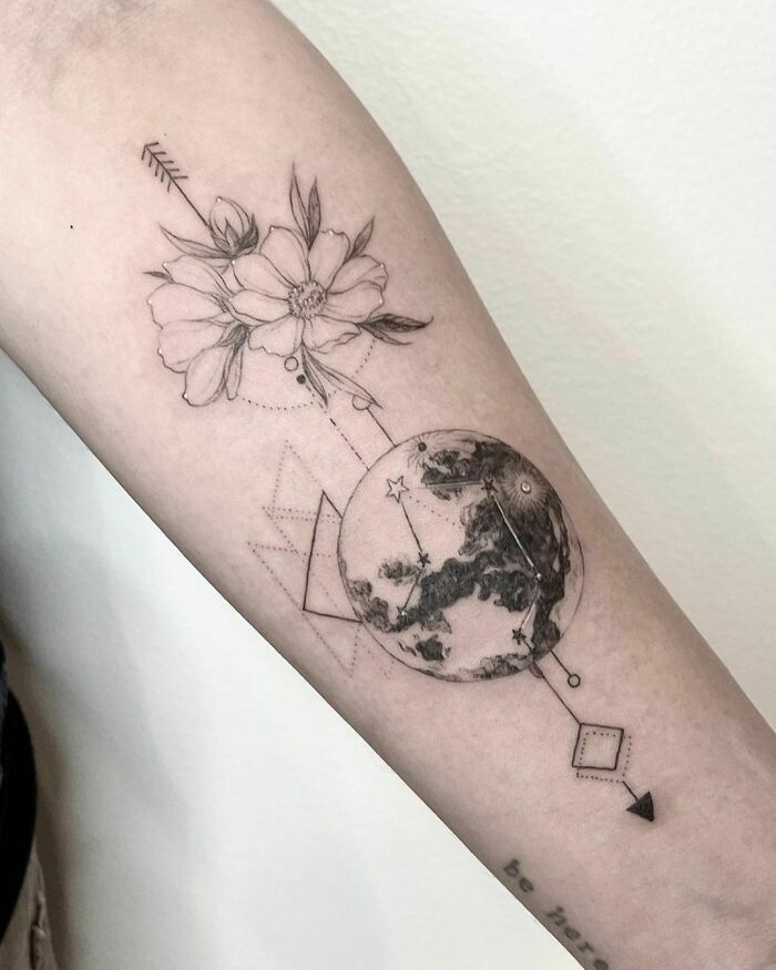 Geometric flower and earth hand tattoo 