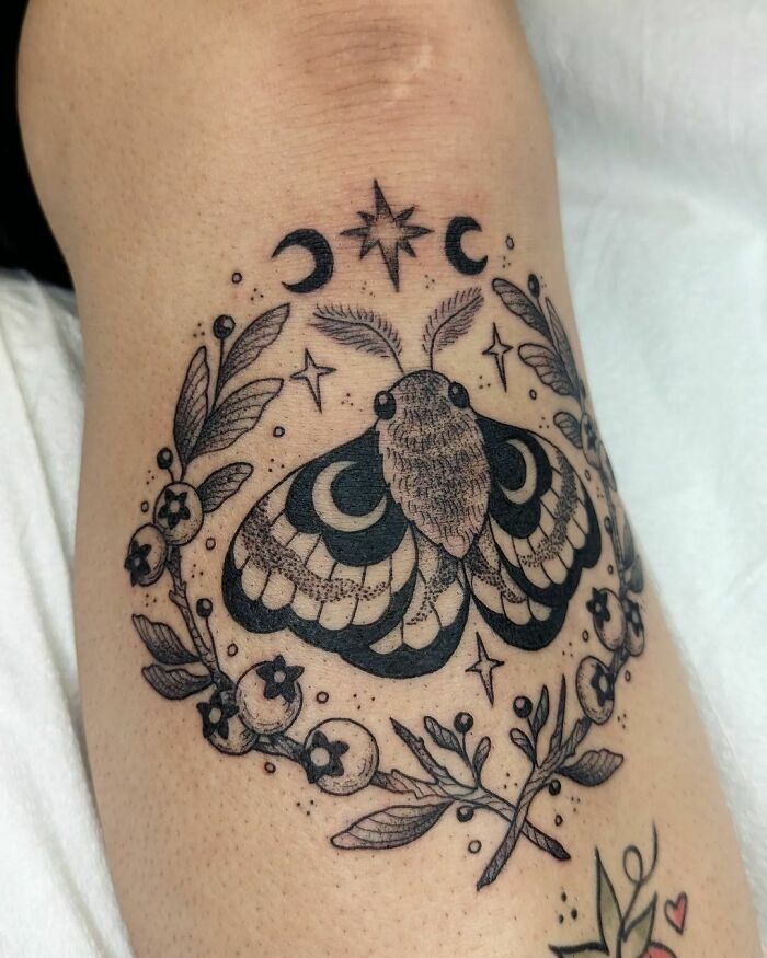 Shin moth tattoo