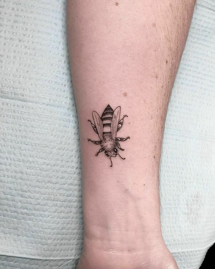 Small bee tattoo