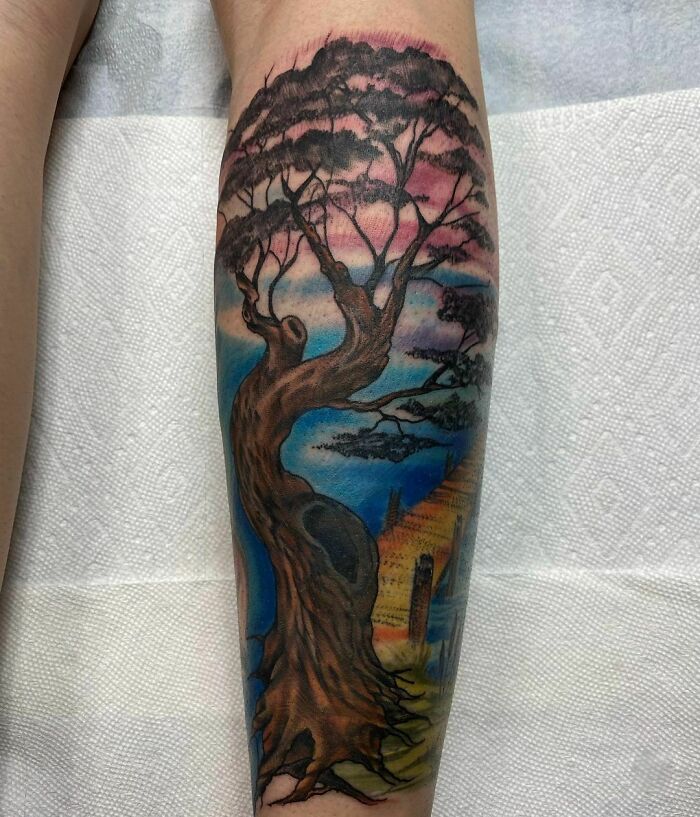 Watercolor tree hand tattoo