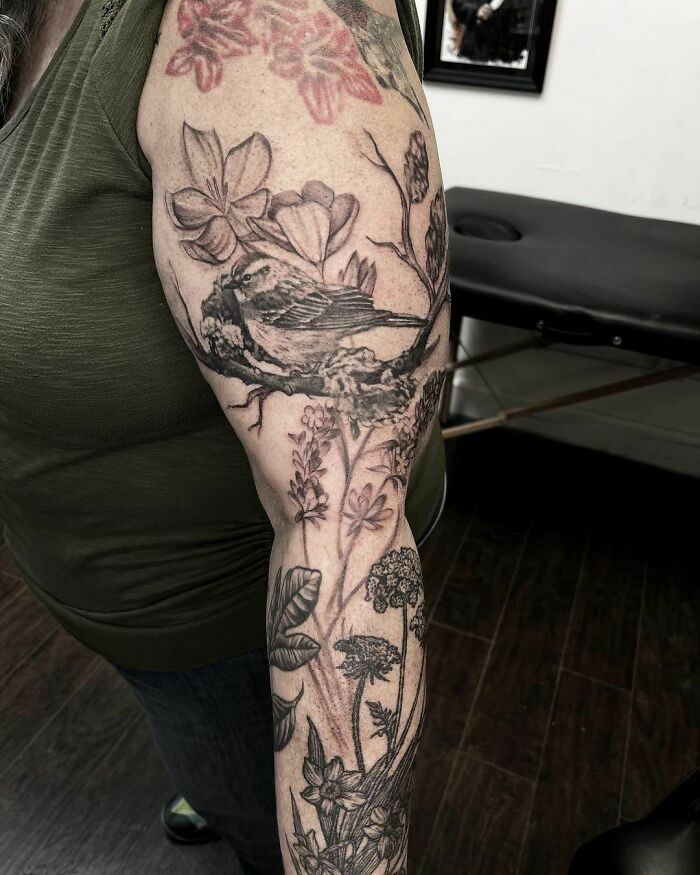 Bird and flowers full arm sleeve tattoo 