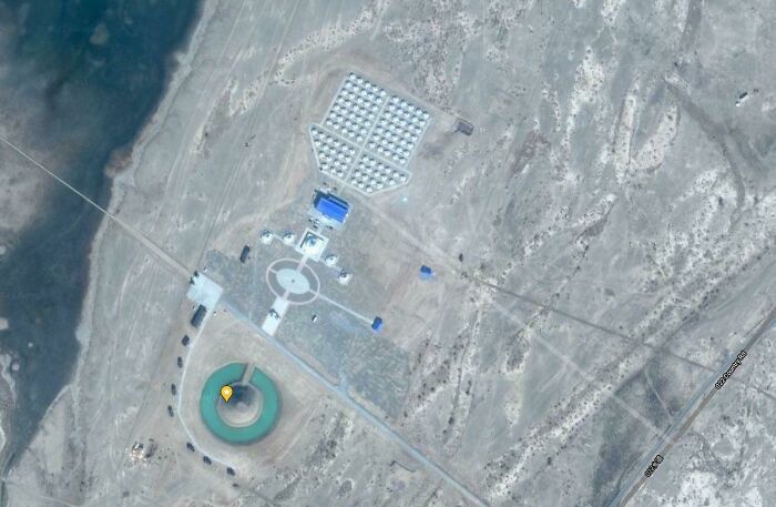 Any Ideas What This Facility Is With A Donut Shaped Pond? Inner Mongolia 41°10'32.5"N 100°24'31.0"E