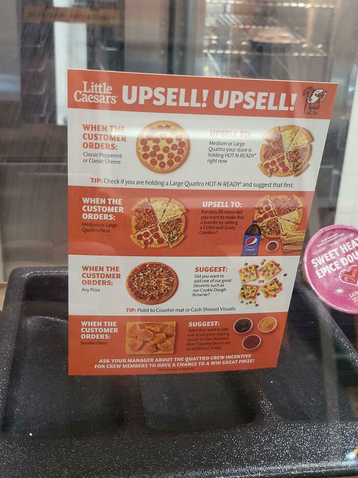 This Little Caesars Has Their "Upsell" Instructions Displayed On Their Front Counter