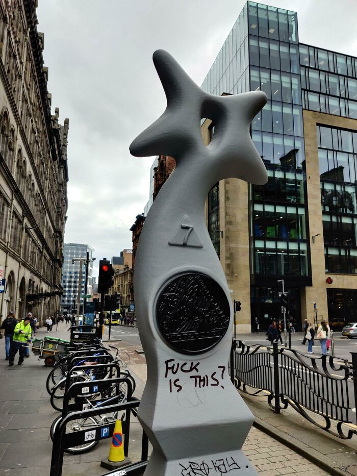 This Strange Sculpture Has Popped Up In A Few Places Around Glasgow, The Graffiti Is Fitting