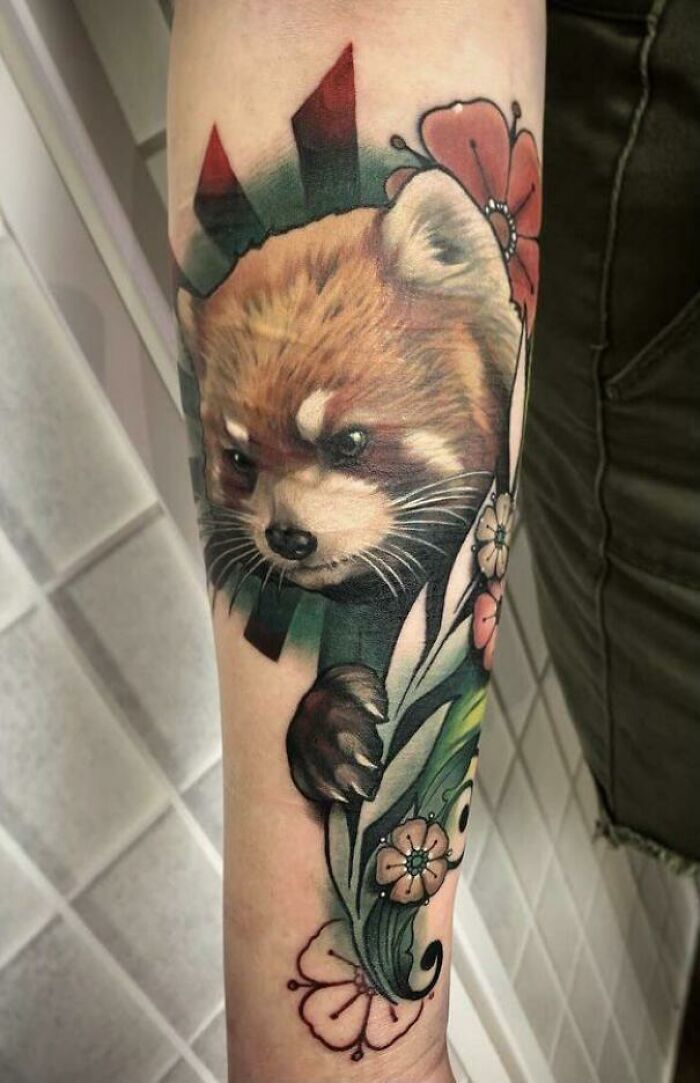 Red panda and flowers tattoo on arm