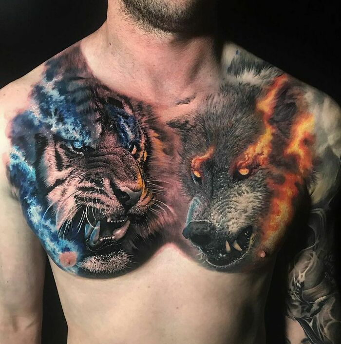 Chest tattoo of a fierce tiger and wolf, showcasing vibrant animal tattoo art.