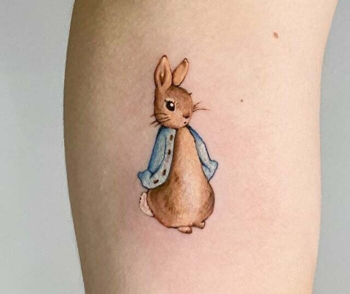 Peter rabbit with light blue jacket tattoo