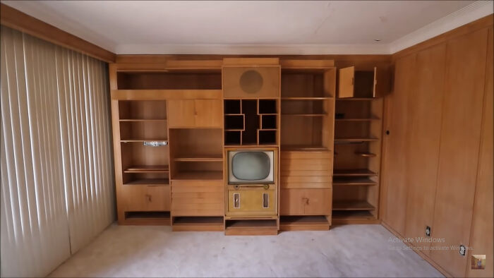 Teak Built In Wall Unit In Abandoned Home