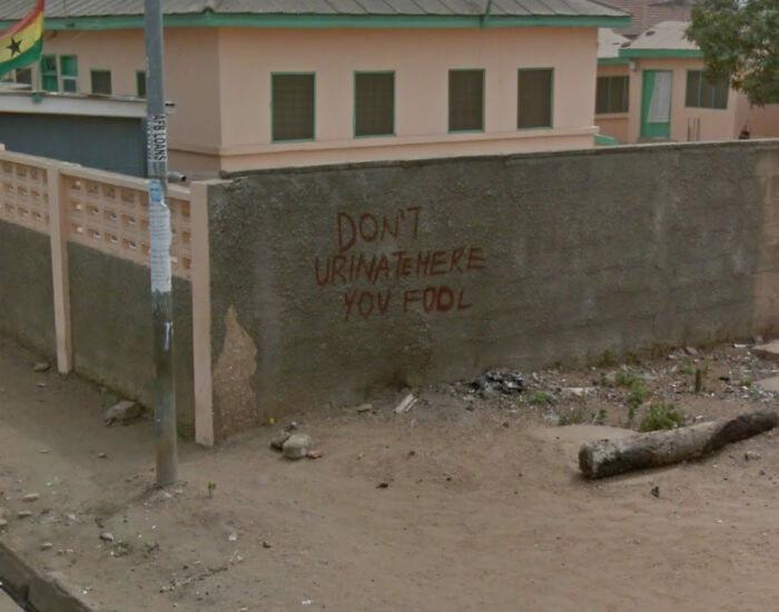 On A Wall On The Side Of A Road In Ghana