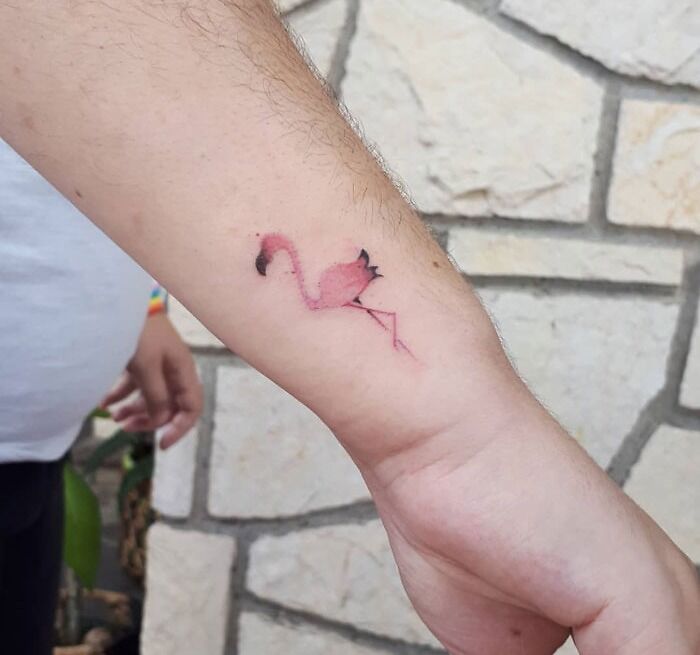 Little pink flamingo tattoo on arm