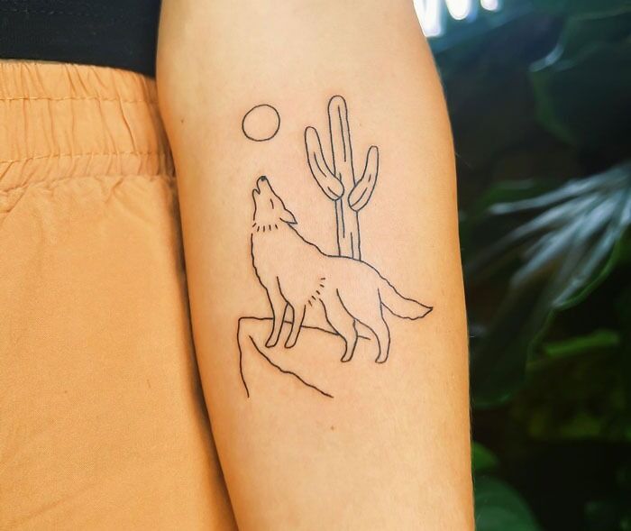 Simple linear wolf, moon and cactus tattoo