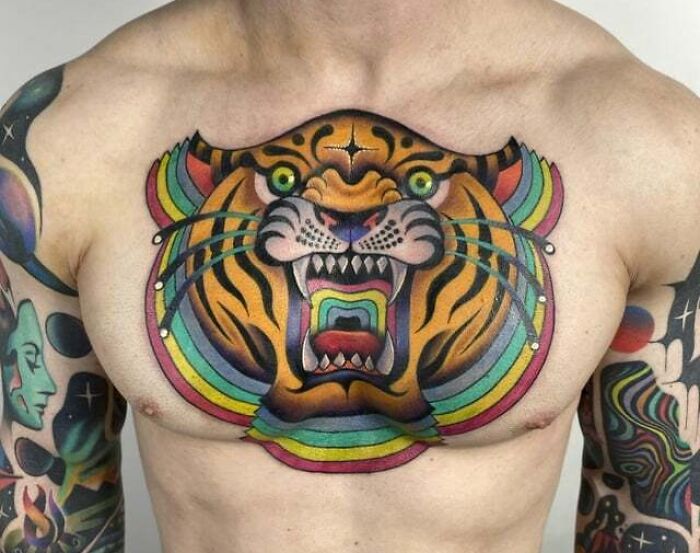 Colorful roaring tiger face tattoo on chest