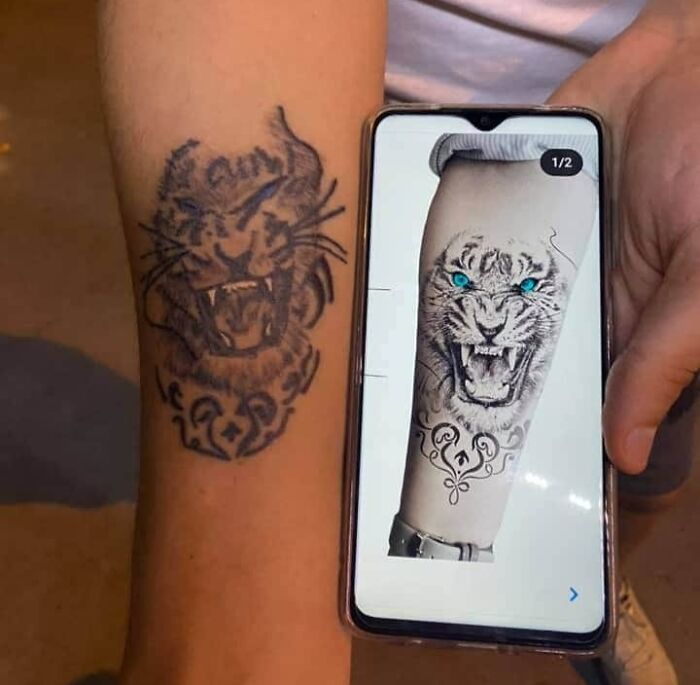 Poorly designed tiger arm tattoo 