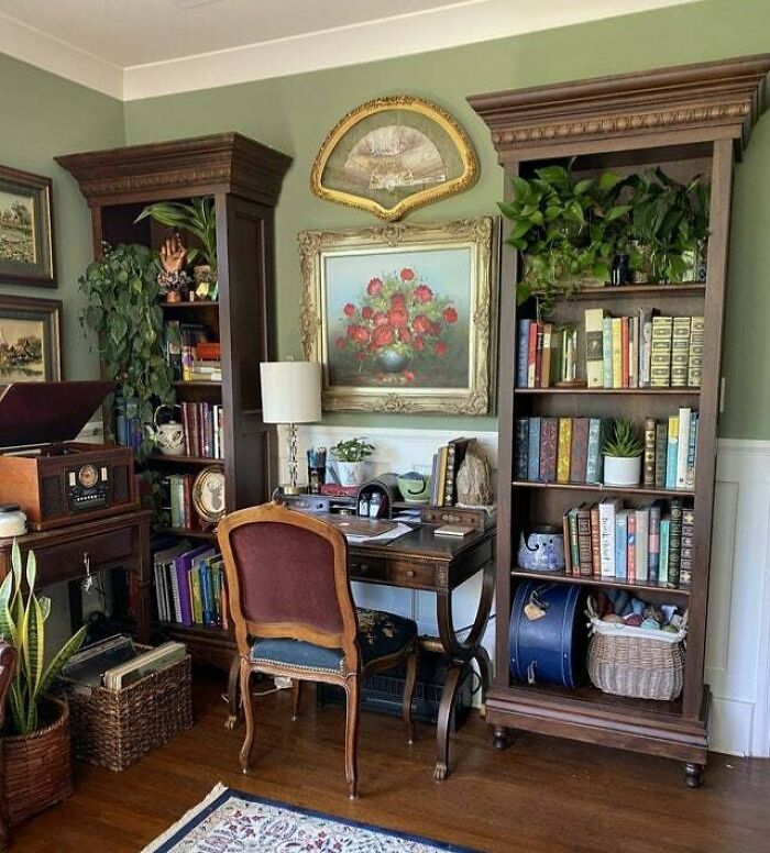 brown bookshelf with plants 