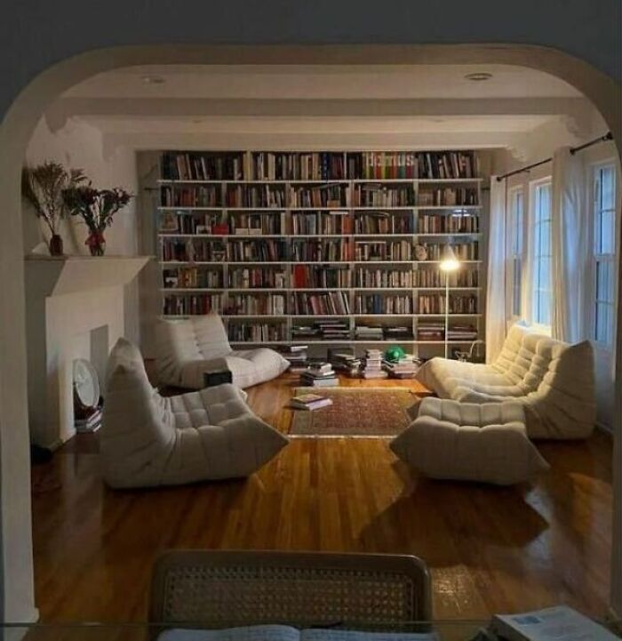 Living room with white couch and bookshelf 