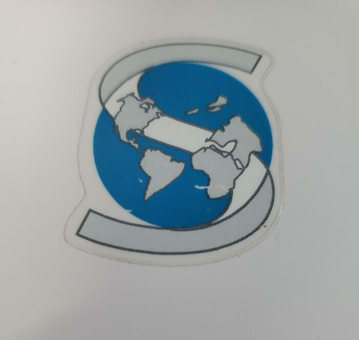 A Logo Including A Globe Where Greenland, Iceland And The UK Have Decided To Fly Away Into The Arctic