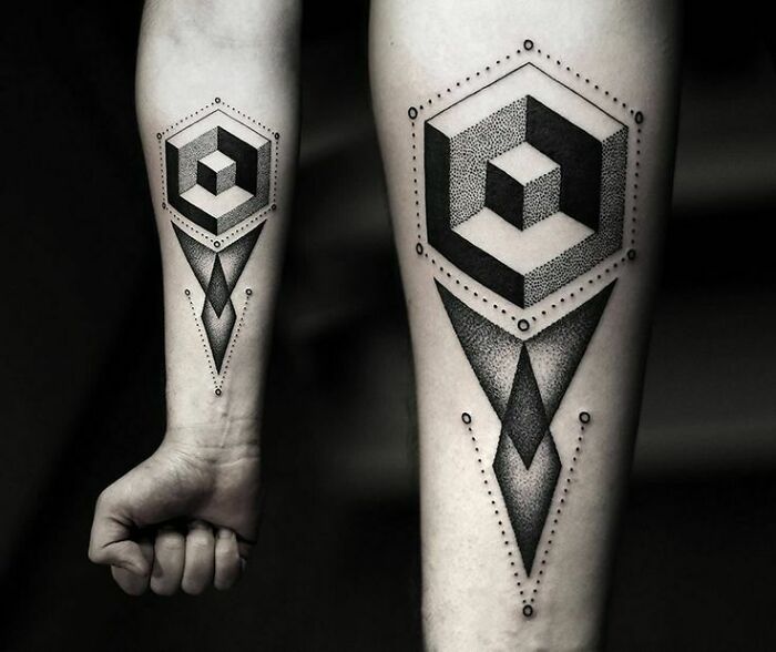 Geometric tattoos with hexagon and diamond shapes on forearm, showcasing creativity in intricate design.