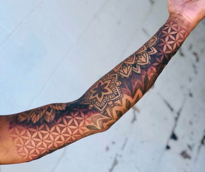 Geometric abstract arm sleeve tattoo