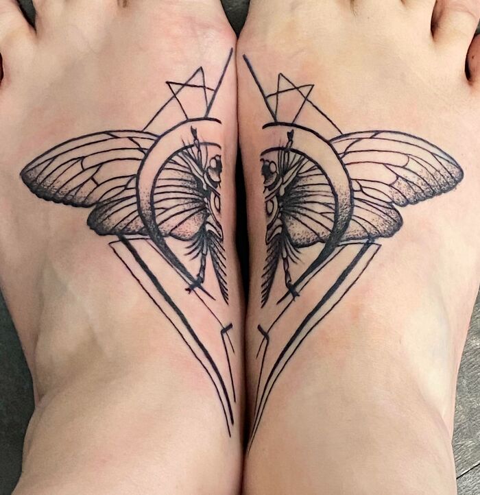 Geometric tattoos of moths with abstract shapes on both feet.