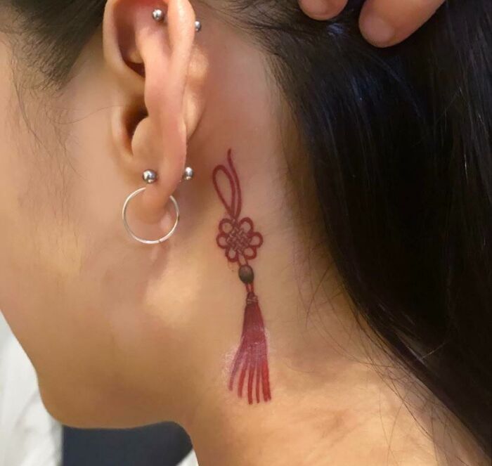 ear tattoo of a norigae